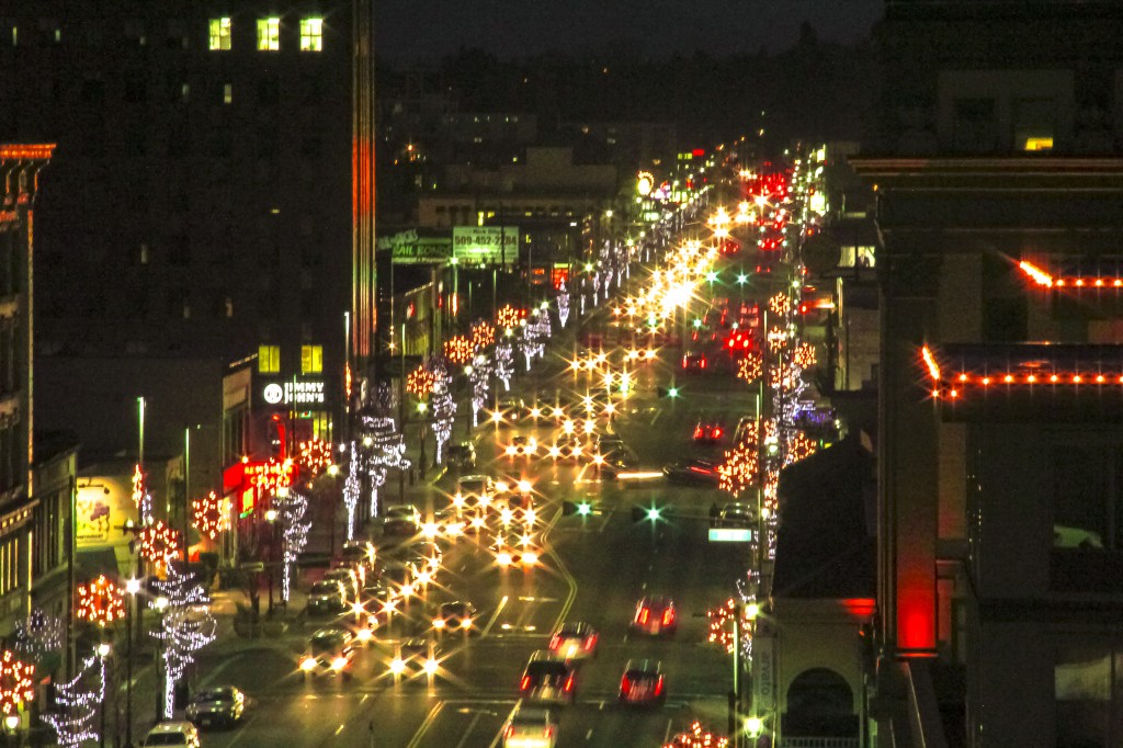 Traffic lights add extra twinkle as decorative lights frame Yakima Avenue during the Holiday season.