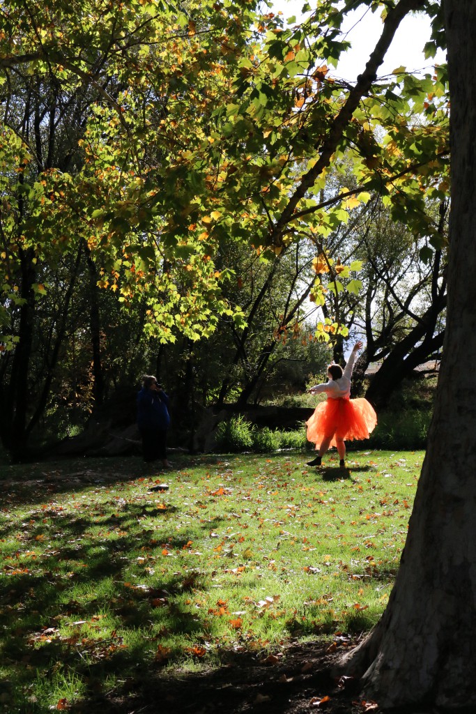 A photographer and her model take the opportunity for a photo shoot during a spectacular fall day in a Yakima Park.