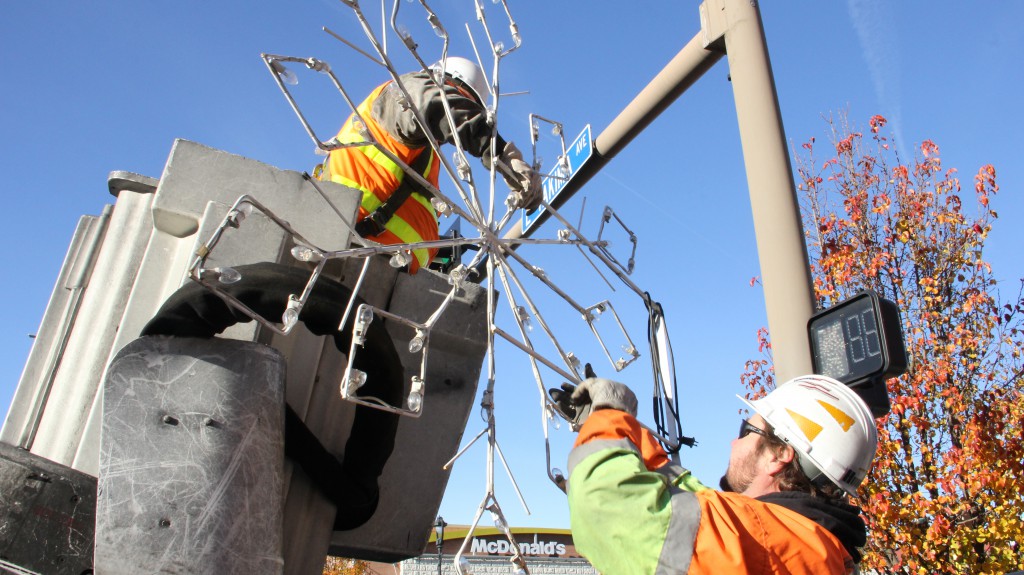 City of Yakima crews hang lights and decorations in downtown Yakima that signify the start of the  holiday season.