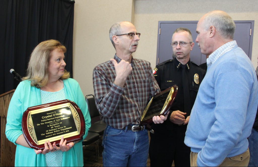 Former YPD Detective Doug Robinson (26 years) and Police Services Supervisor Crystal “Chris” O’Neal (39 Years) explain their plans for the future to City Manager Tony O’Rourke following their recent retirement celebration at the Yakima Convention Center. 