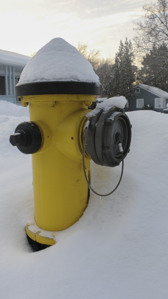 Piles of accumulated snow surround a fire hydrant in a Yakima neighborhood which make it even more difficult for firefighters to respond in the event of an emergency. 