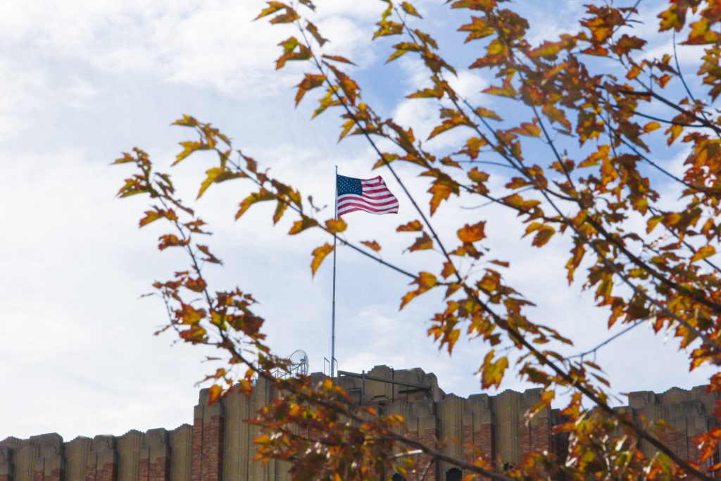 Old Glory stands tall amid the sure signs of fall in downtown Yakima.