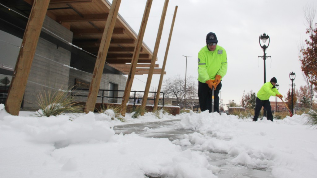 Downtown crews shovel the sidewalks on 2nd Street after an early season snowfall in Yakima.