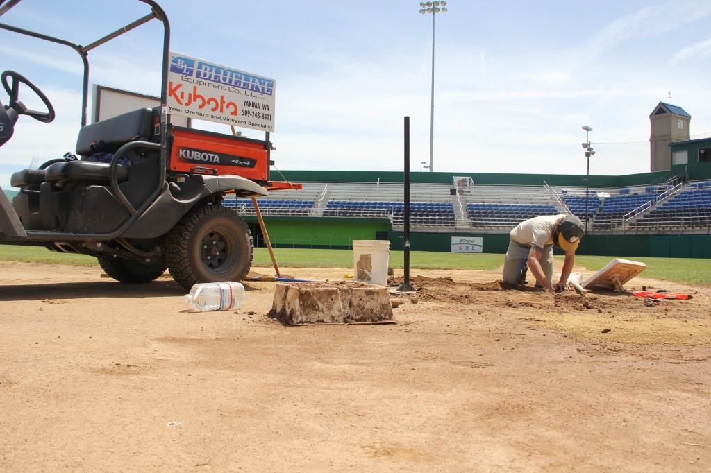 Yakima Valley Pippins Head Groundskeeper Shawn ___ works on third base prepping Yakima County Stadium for the return of baseball with a new look on June 6th when the Yakima Valley Pippins begin their season.