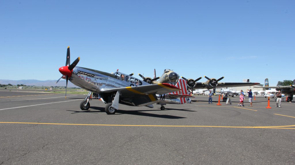 P-51 mustang lands at McAllister field. 1 of  4 historic World War 2 era planes on display. 