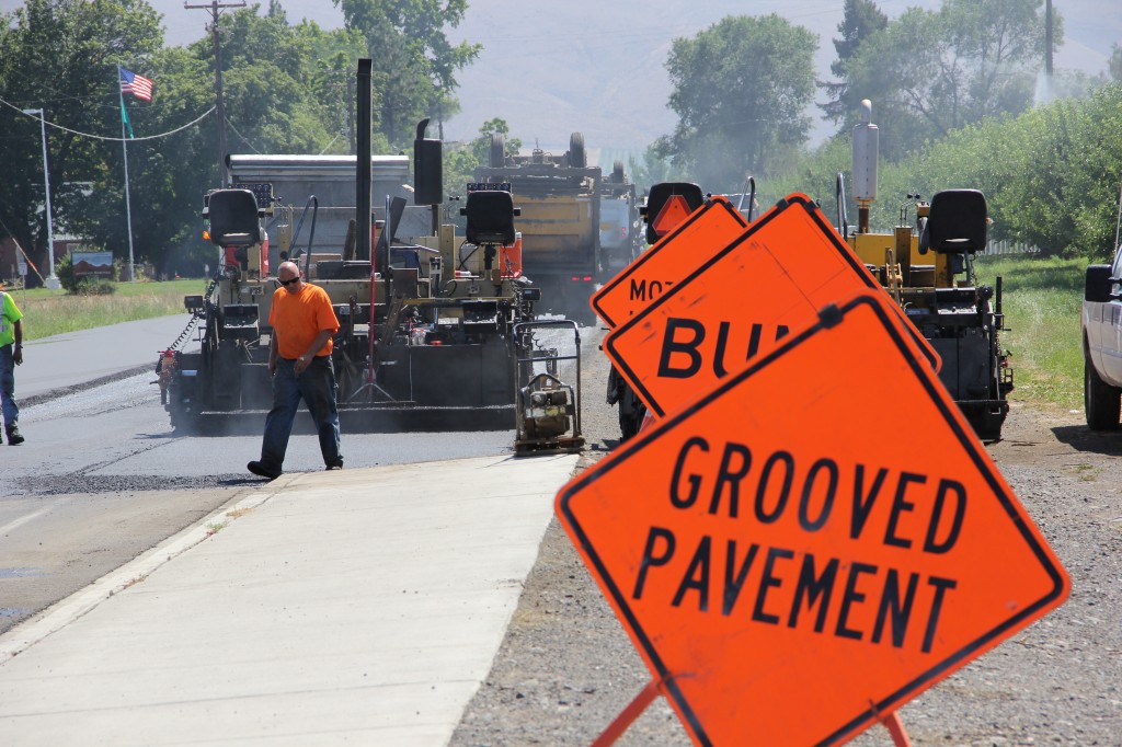 Crews from Columbia Asphalt work through the triple digit heat on 64th Avenue during the City Wide Road Resurfacing Project going on throughout Yakima. 