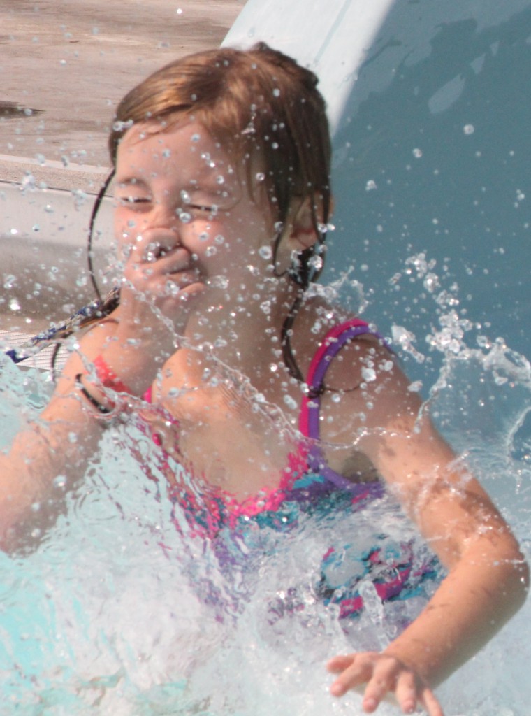 A young swimmer grabs a last breath while plunging in to Franklin Pool which will now stay open until September 23rd due to continued high temperatures in the forecast.