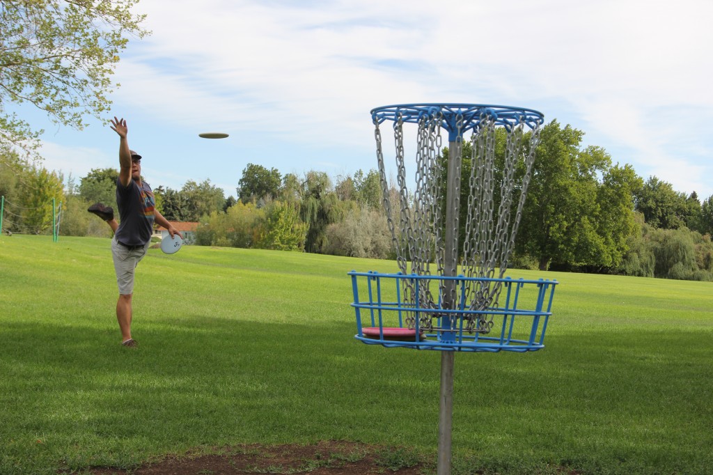 A disc golfer practices his technique on the disc golf course at Yakima's Randall Park.