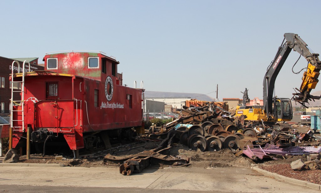 Demolition crews dismantle the boxcars from the Track 29 Mall making room for future development.