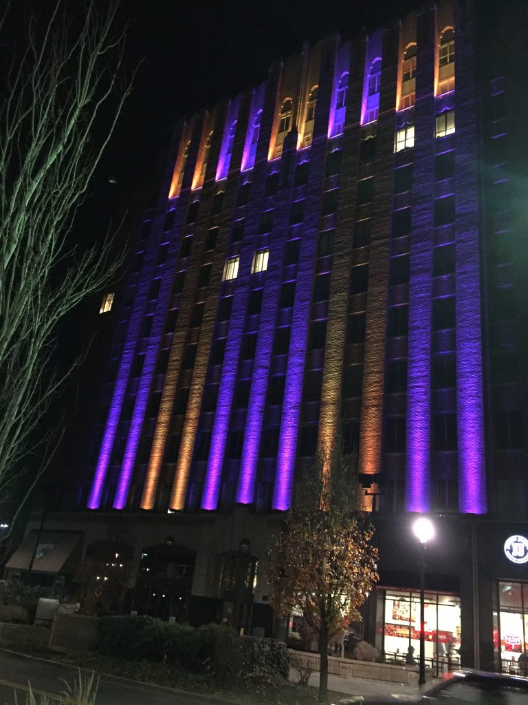 Yakima's Larson Building shows off its new, multi-color exterior lighting system by featuring the purple and gold of the Washington Huskies.