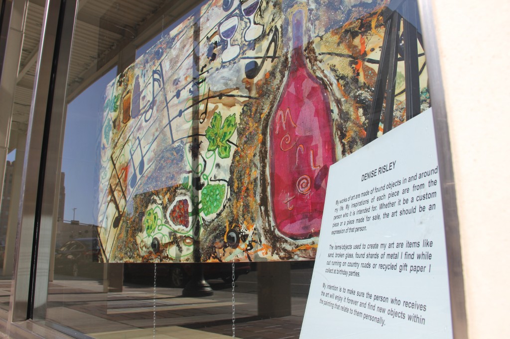 Denise Risley's painting, as part of her Windows Alive! display, fills an empty store window in Downtown.