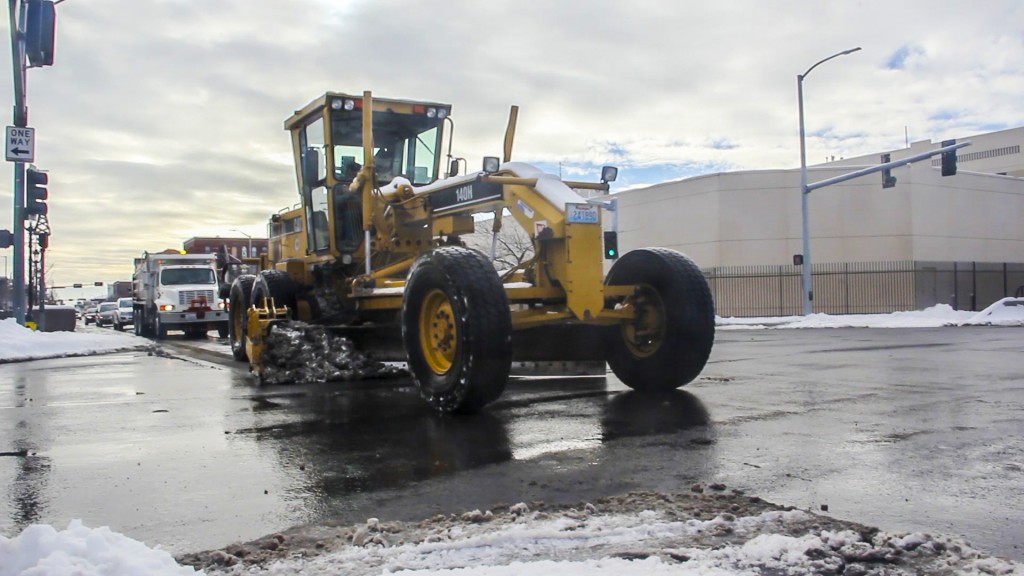 A City of Yakima crew clears North 1st Street after more snow covers Yakima streets during the holiday weekend. 