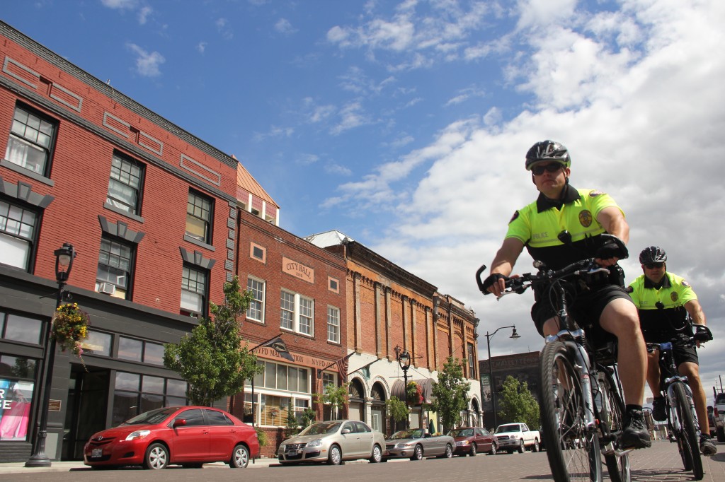 Yakima Police Officers  Nate Henyan (front) and Scott Gylling (back) ride down North Front Street patrolling Downtown Yakima for the next three months.  