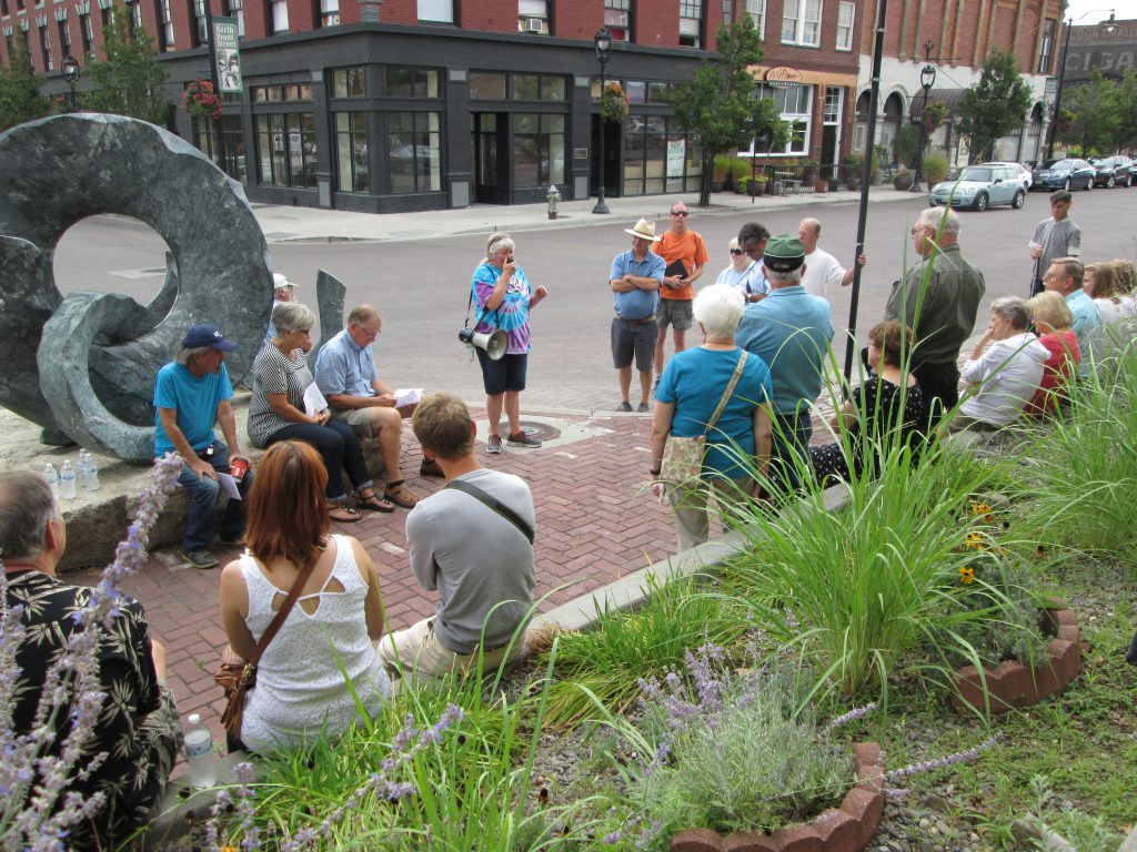 Ellen Allmendinger guides a large group on a tour of Yakima's history. Photo by Ken Crockett  