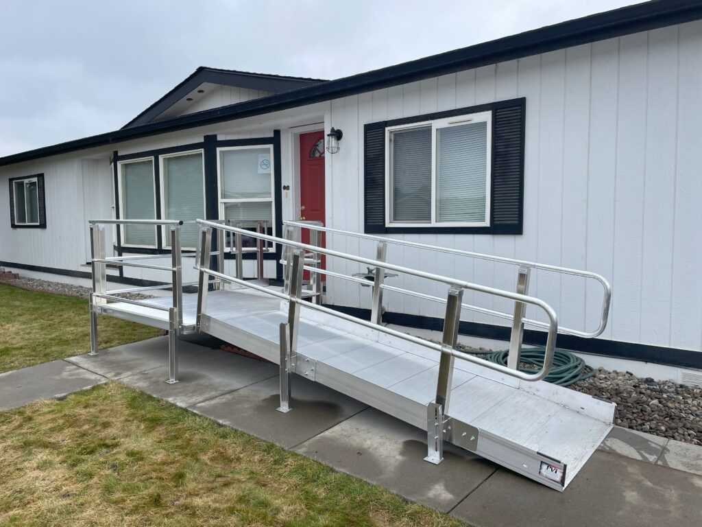 Photo of a wheelchair ramp that was installed for the entrance to a house.
